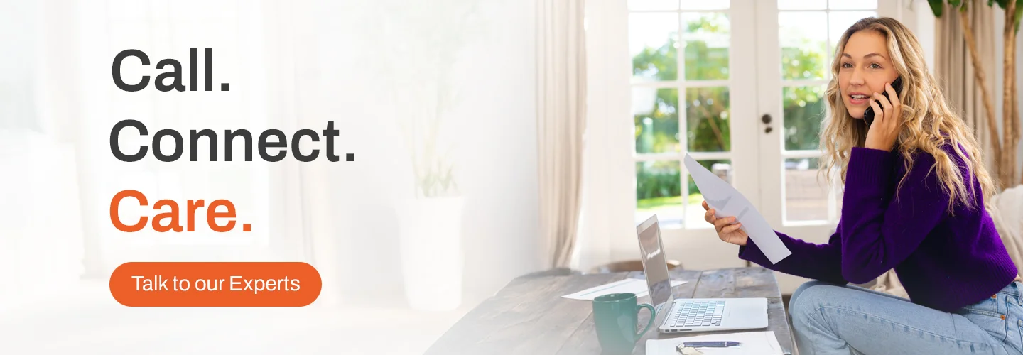 Customer support expert on phone with laptop and documents, promoting Call, Connect, Care service – Talk to our Experts. - Optimizing Hospital Call Centers to Enhance Patient Experience - Lockstep Technology Group