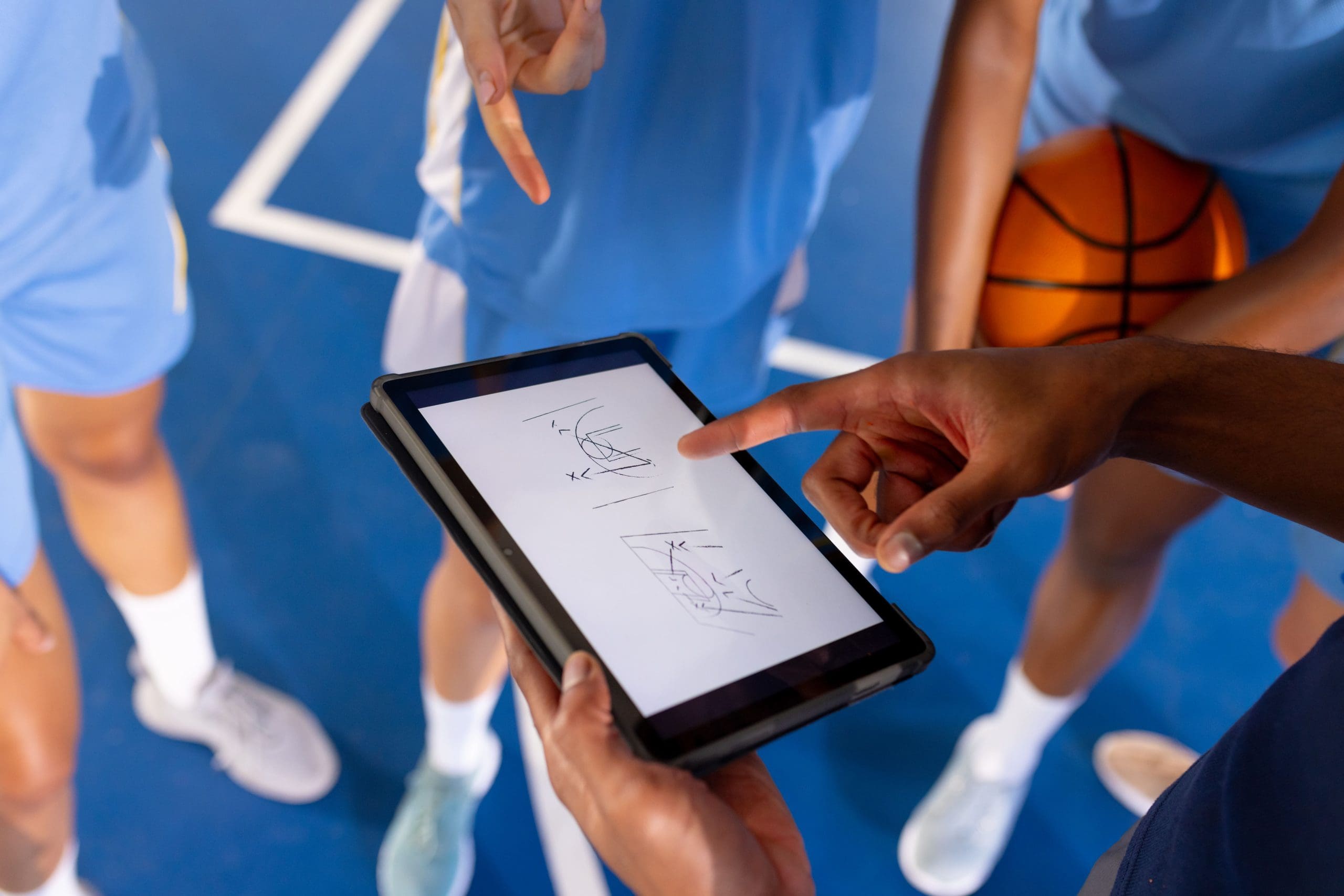 basketball-male-coach-using-tablet-to-discuss-game-2025-04-05-00-57-03-utc